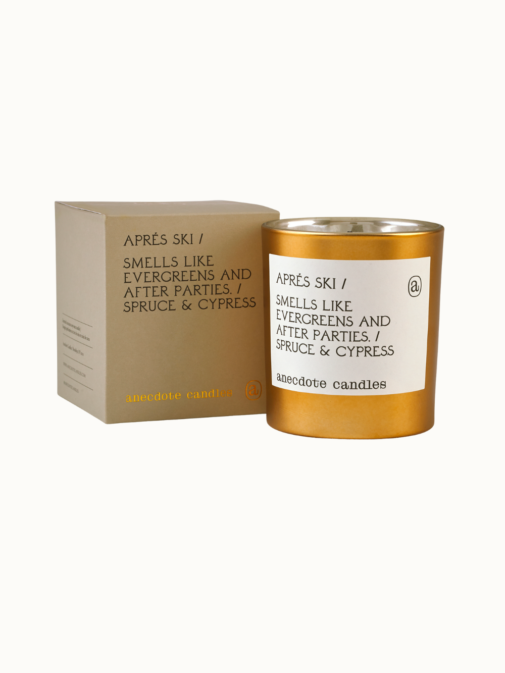 Anecdote Candles Aprés Ski Candle in gold tumbler with fragrance notes of spruce and cypress, a perfect holiday gift